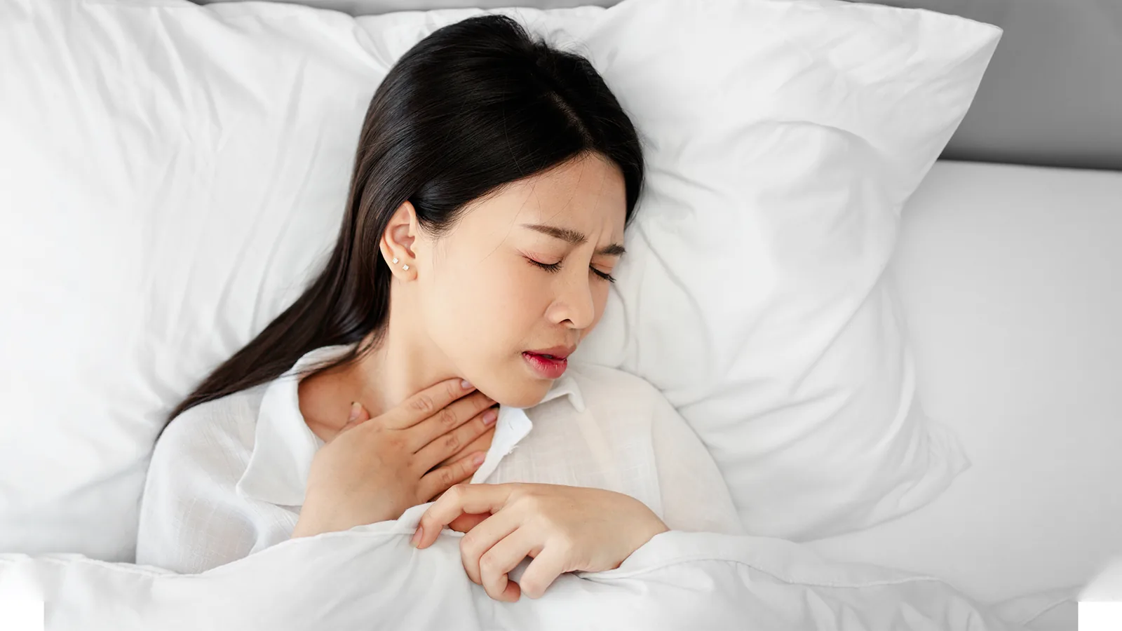 Woman lying awake in bed at night